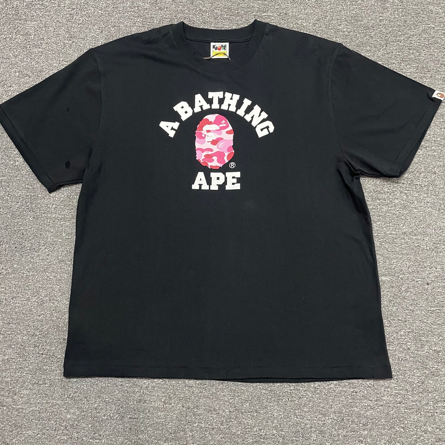 Black BAPE ABC Camo College T-shirt front view with pink camo Ape Head logo