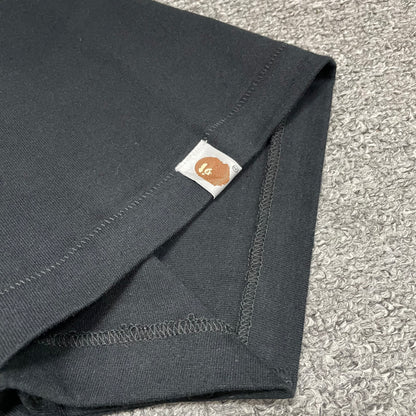 BAPE Ape Head sleeve label detail on black Space Camo T-shirt