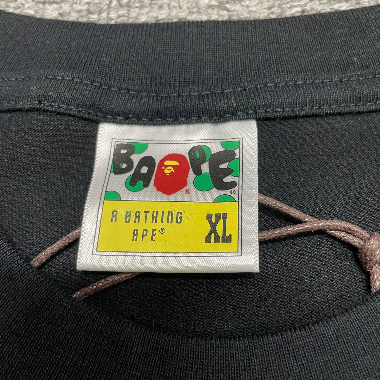 BAPE neck label detail on black Space Camo Big Ape Head T-shirt