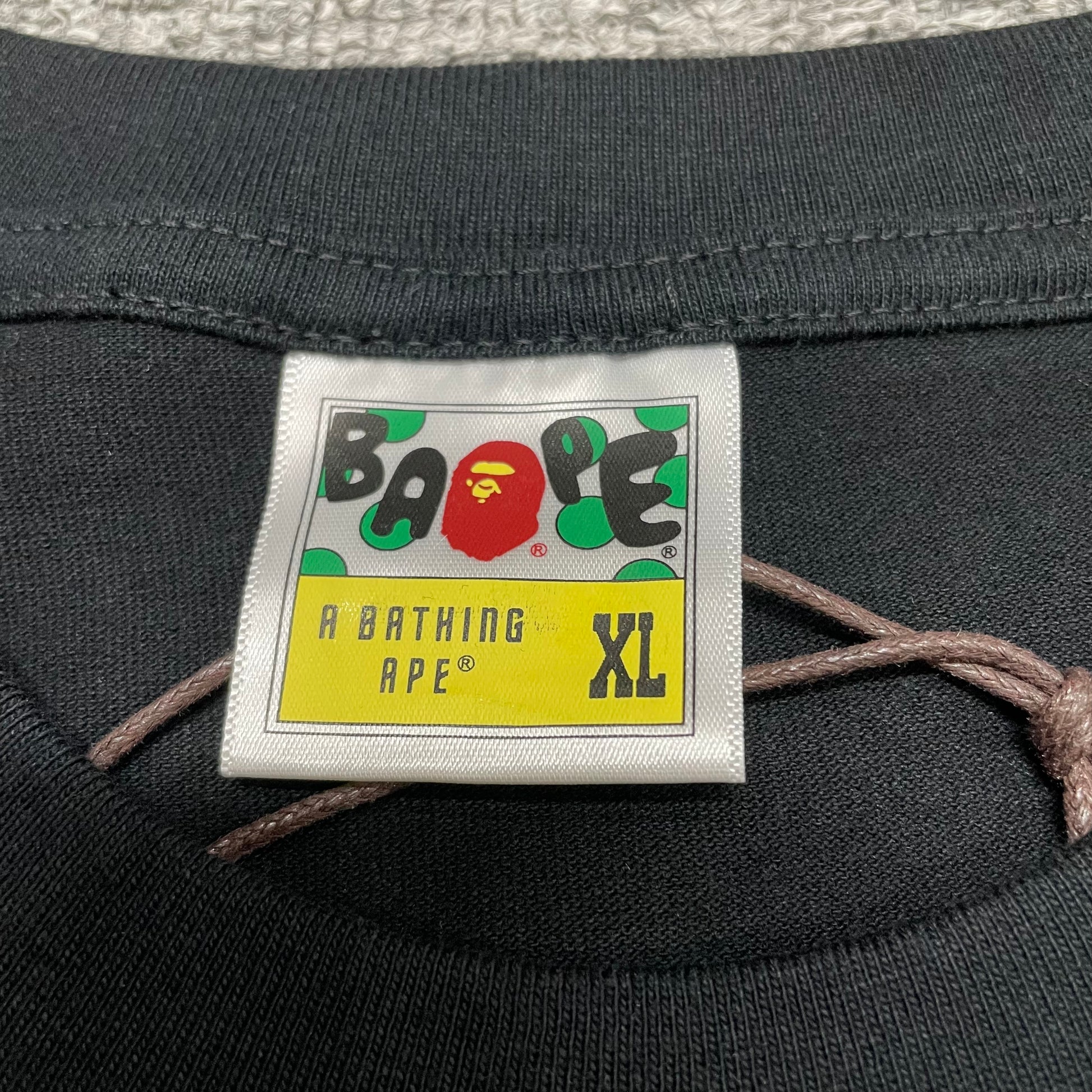 BAPE neck label detail on black Space Camo Big Ape Head T-shirt