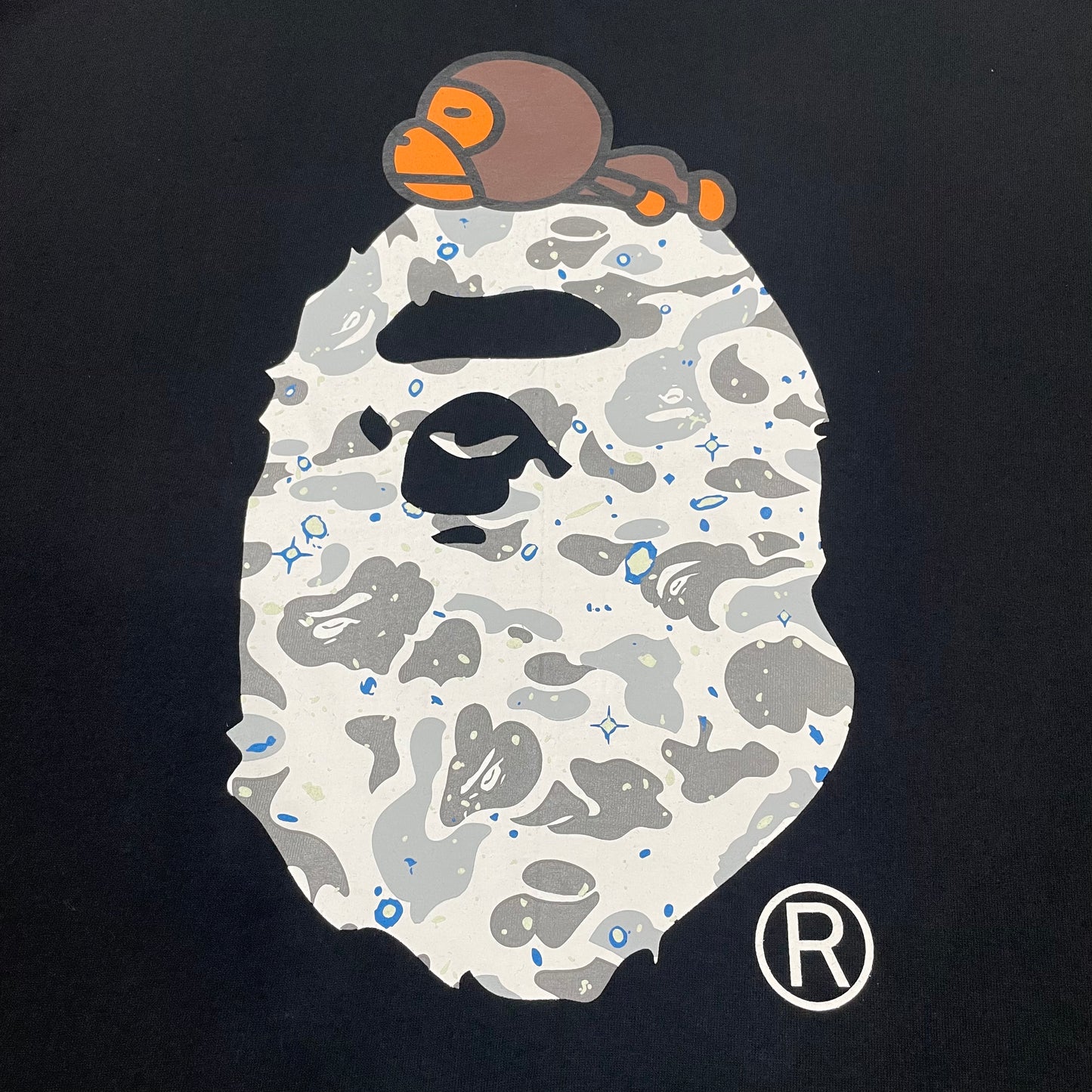 Close-up of Baby Milo detail on black BAPE Ape Head T-shirt