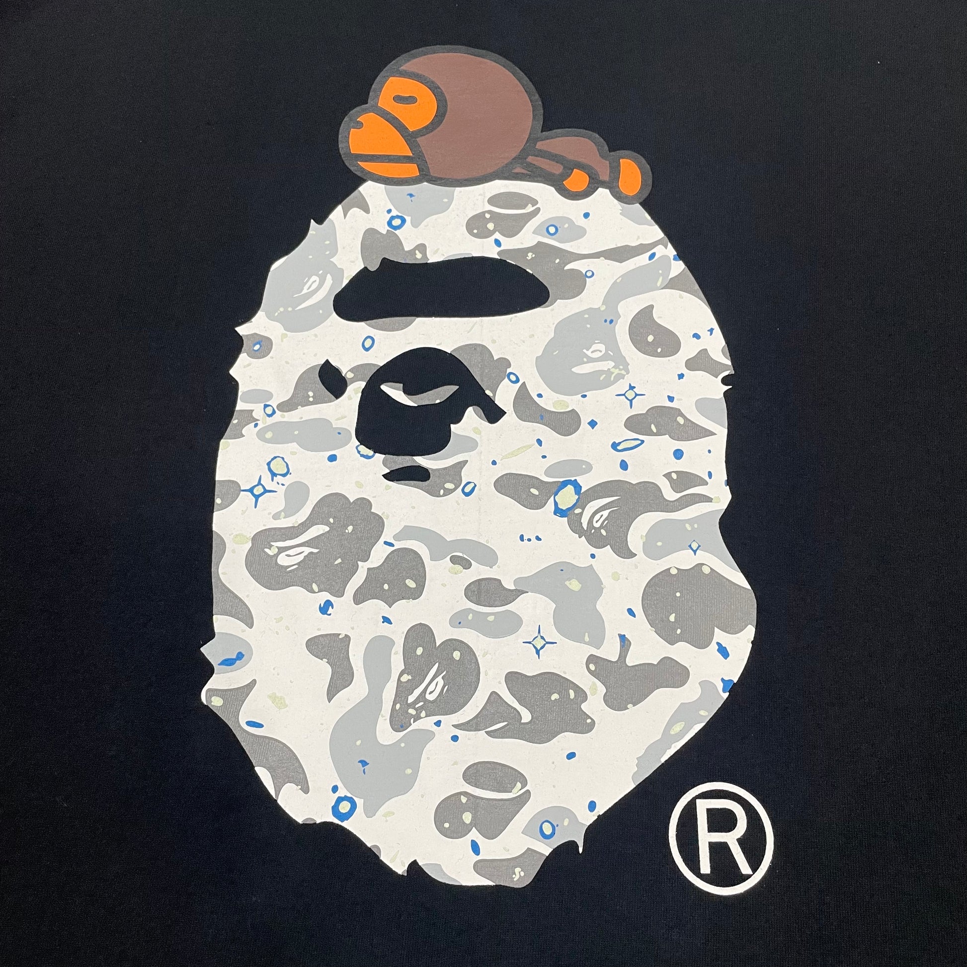 Close-up of Baby Milo detail on black BAPE Ape Head T-shirt
