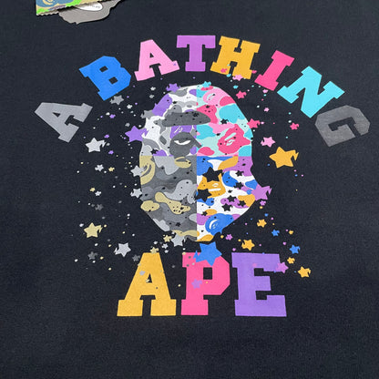Close-up of multicolor STA stars and Ape Head print on black BAPE T-shirt