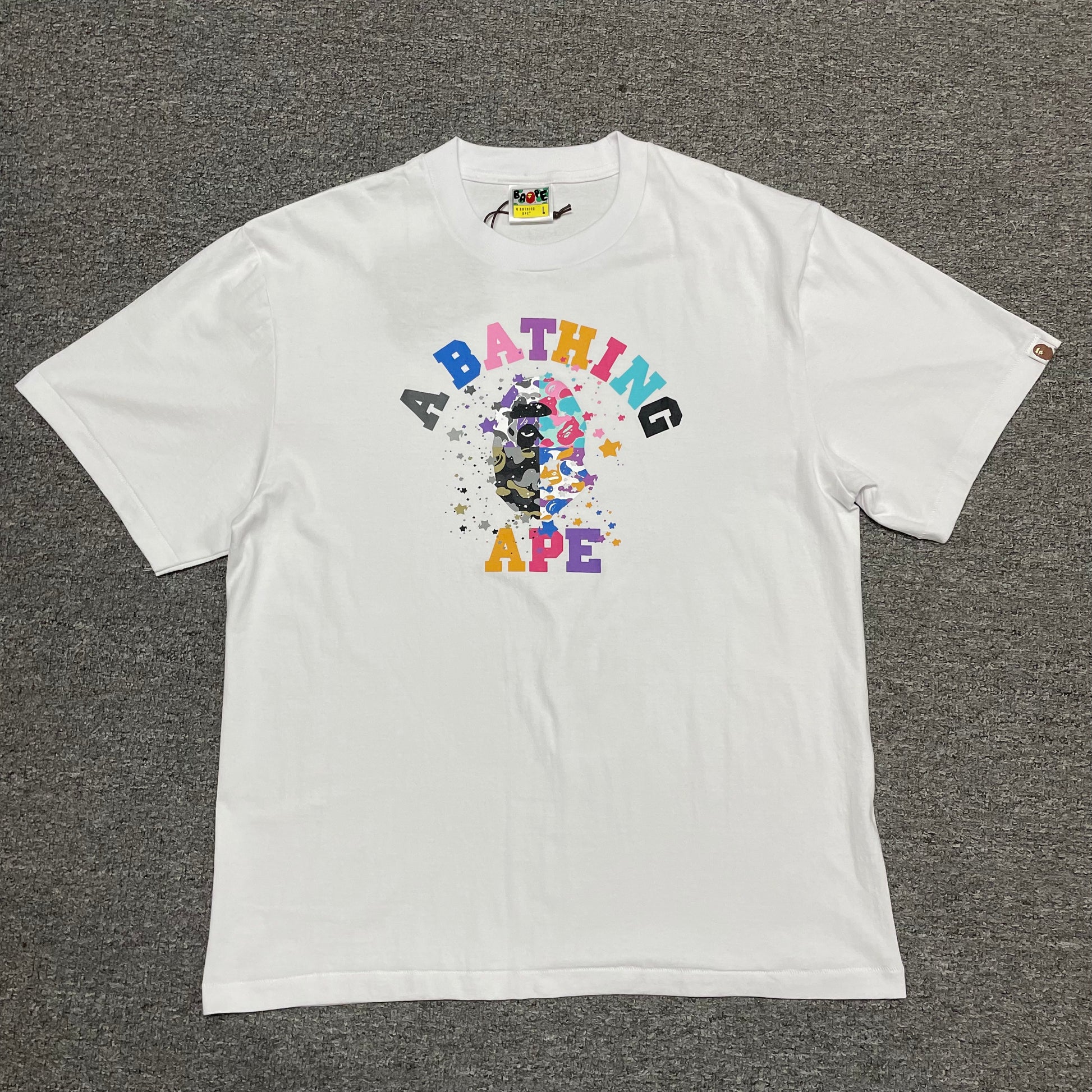 White BAPE STA College relaxed fit T-shirt front view with multicolor Ape Head graphic