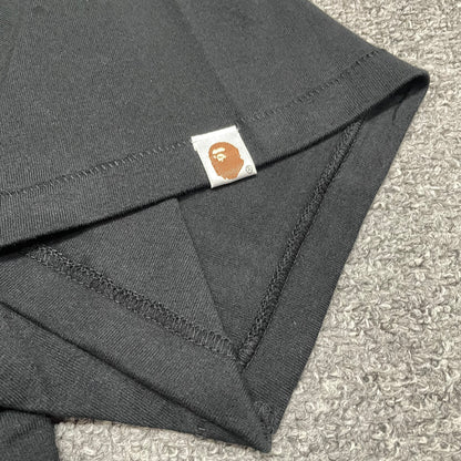 BAPE Ape Head sleeve label detail on black STA College T-shirt
