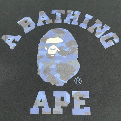 Detailed view of blue camo Ape Head graphic on black BAPE T-shirt