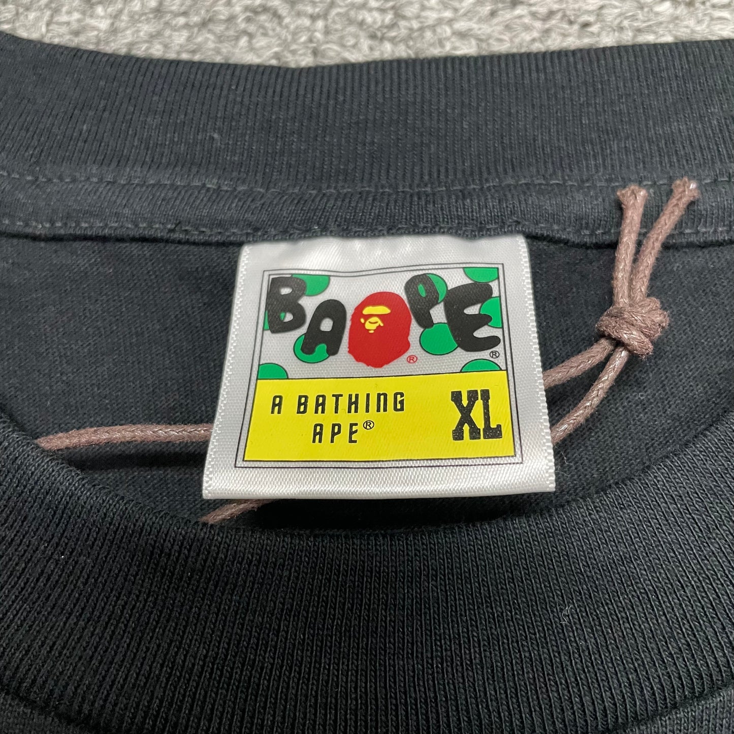 BAPE neck label detail on black ABC Camo College T-shirt