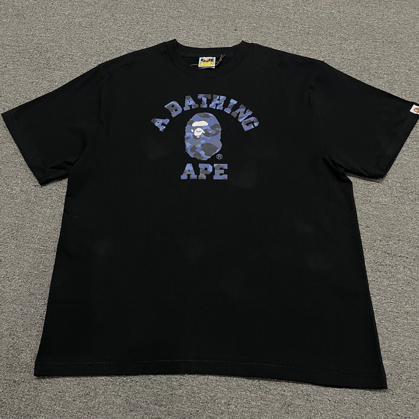 Black BAPE ABC Camo College T-shirt front view with blue camo Ape Head graphic