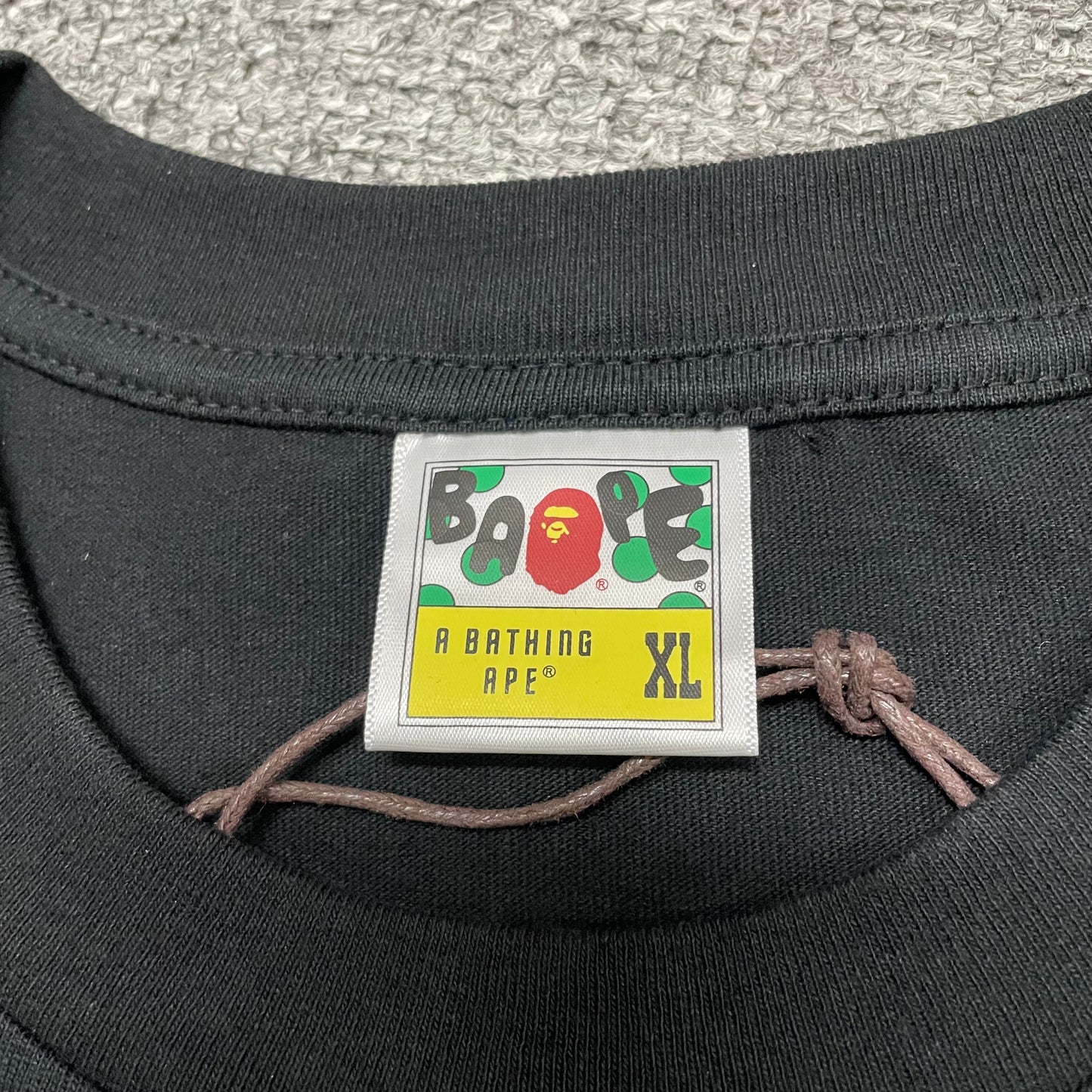 BAPE neck label detail on black and pink ABC Camo College T-shirt