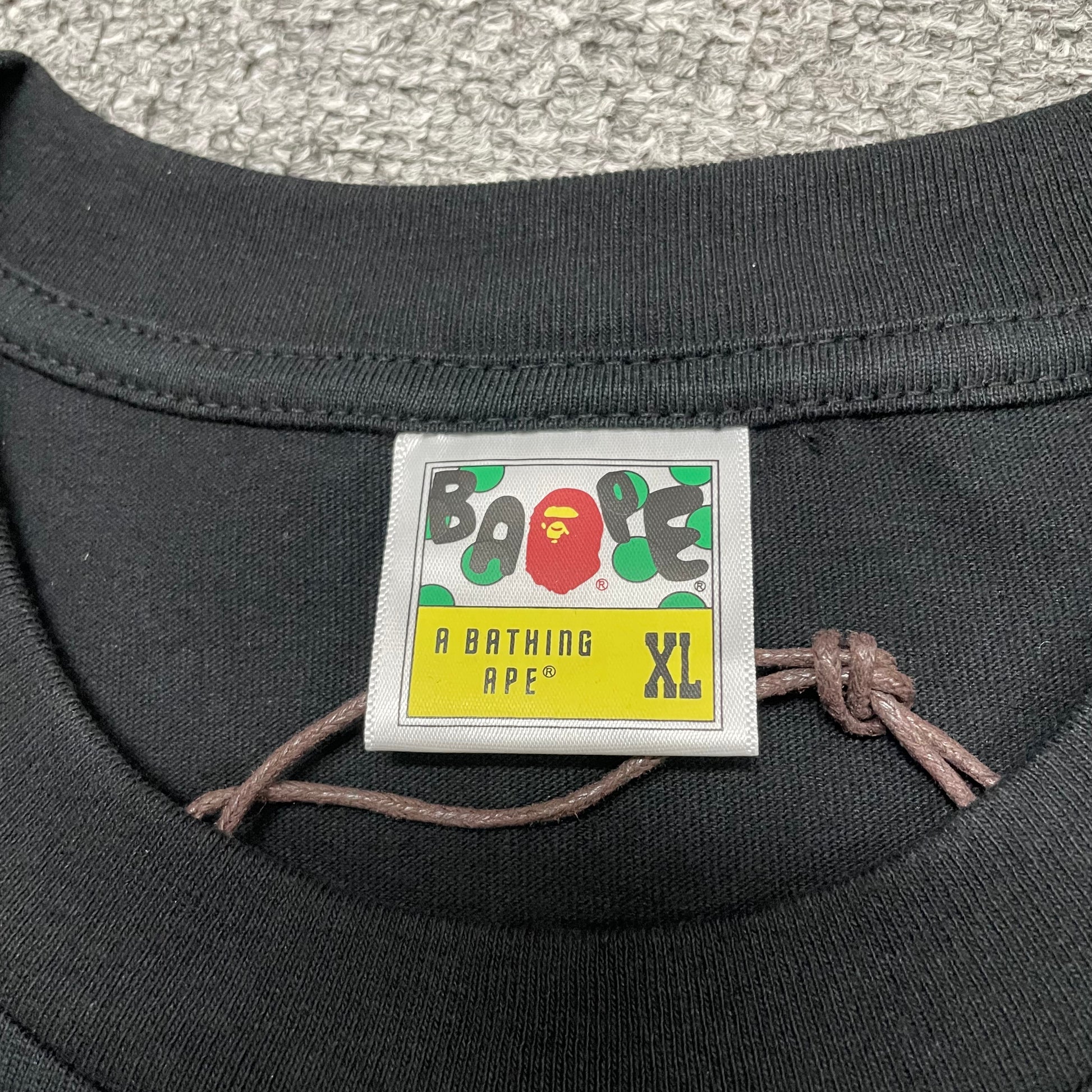 BAPE neck label detail on black and pink ABC Camo College T-shirt
