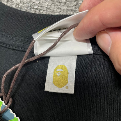Gold label detail on black BAPE ABC Camo College T-shirt