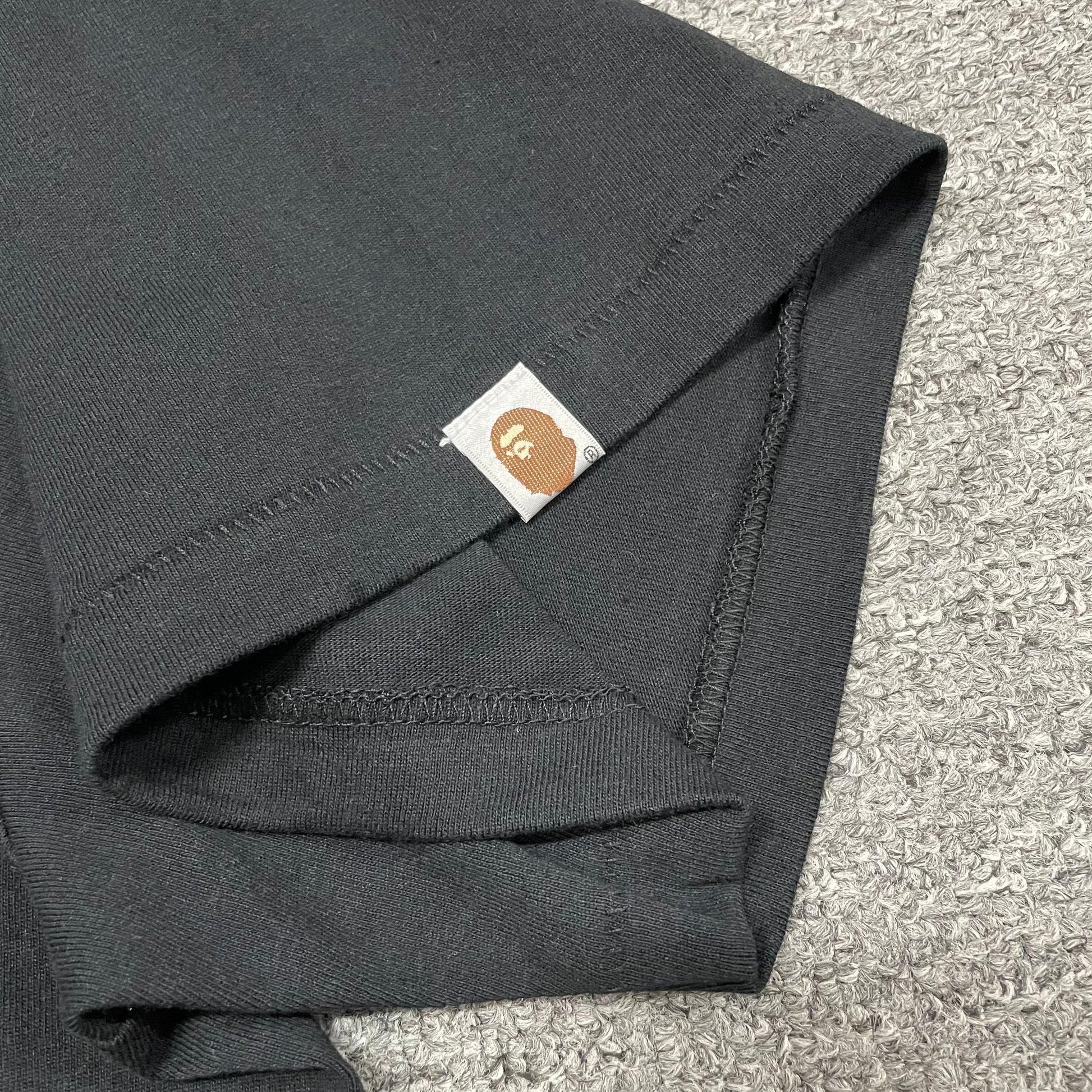 BAPE Ape Head sleeve label detail on black ABC Camo College T-shirt
