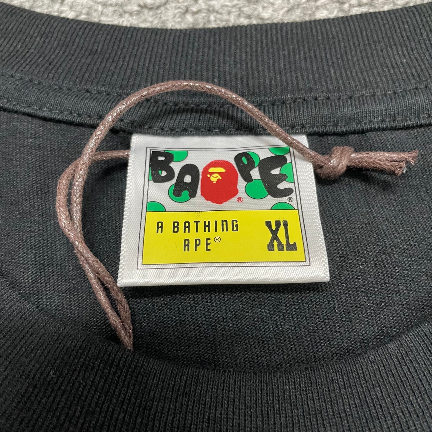 BAPE neck label detail on black US Ape Head STA T-shirt