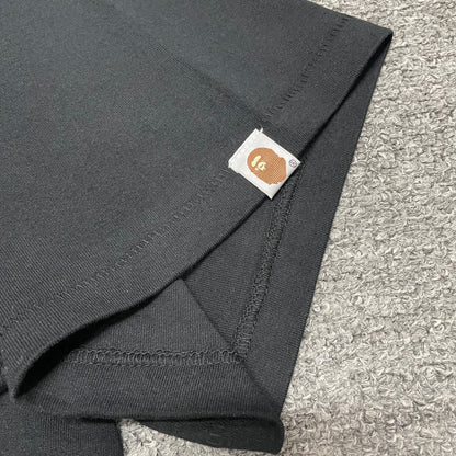 BAPE Ape Head sleeve label detail on black US Ape Head STA T-shirt