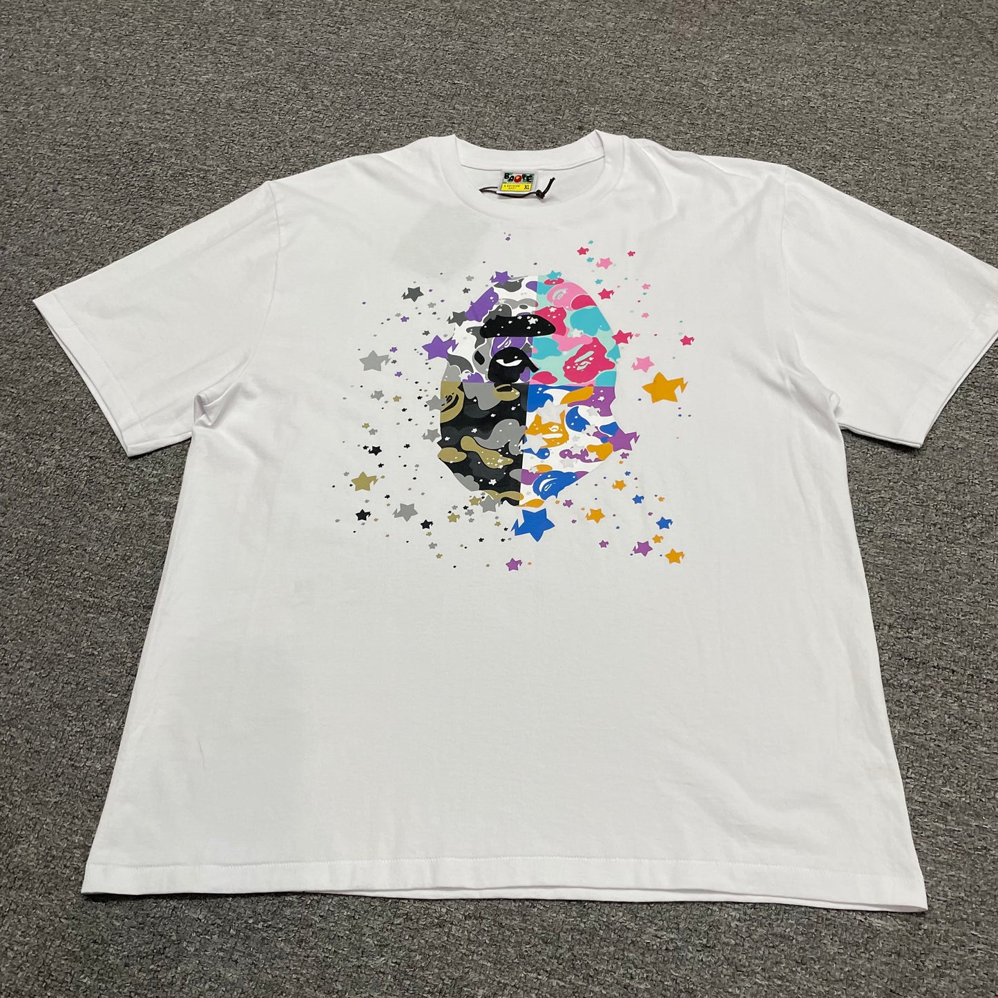 White BAPE US Ape Head STA T-shirt front view with multicolor graphic