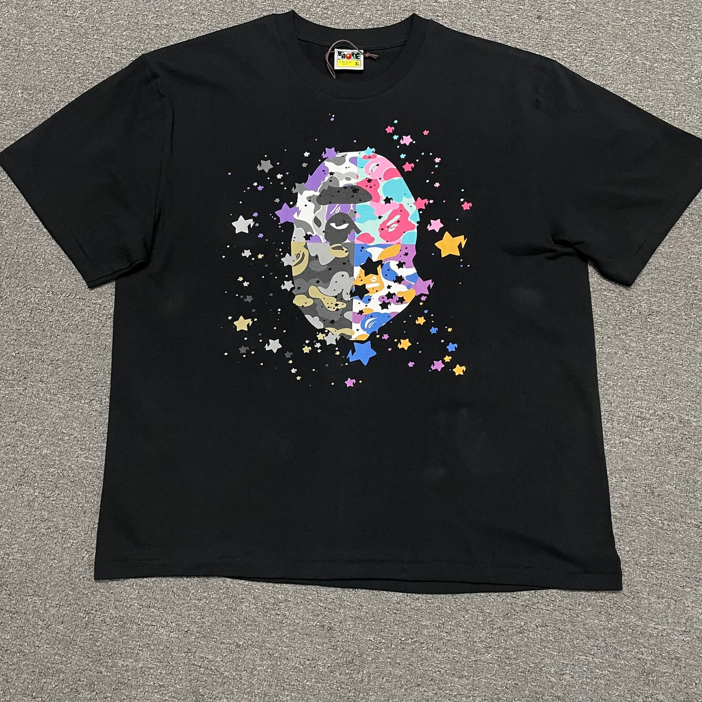 Black BAPE US Ape Head STA T-shirt front view with multicolor graphic