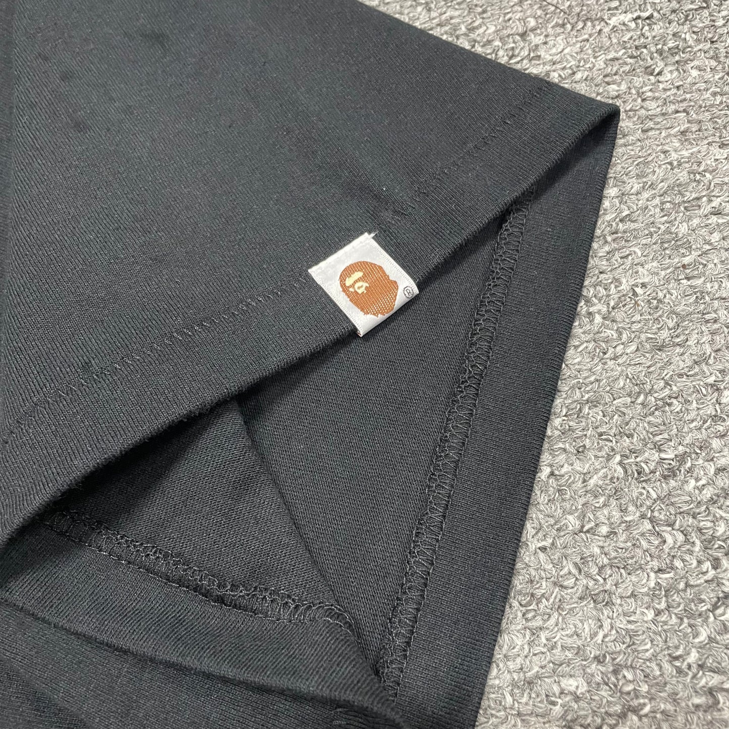 BAPE Ape Head sleeve label detail on black Space Camo College T-shirt