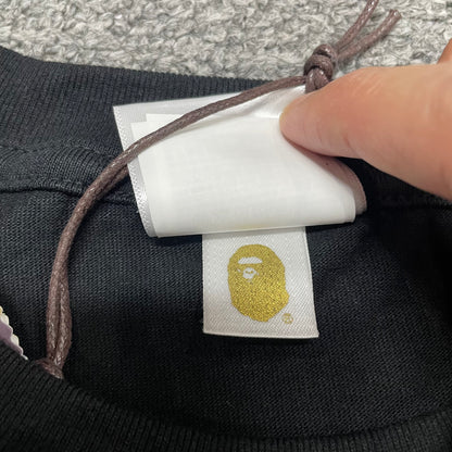 Gold label detail on black BAPE Space Camo College T-shirt