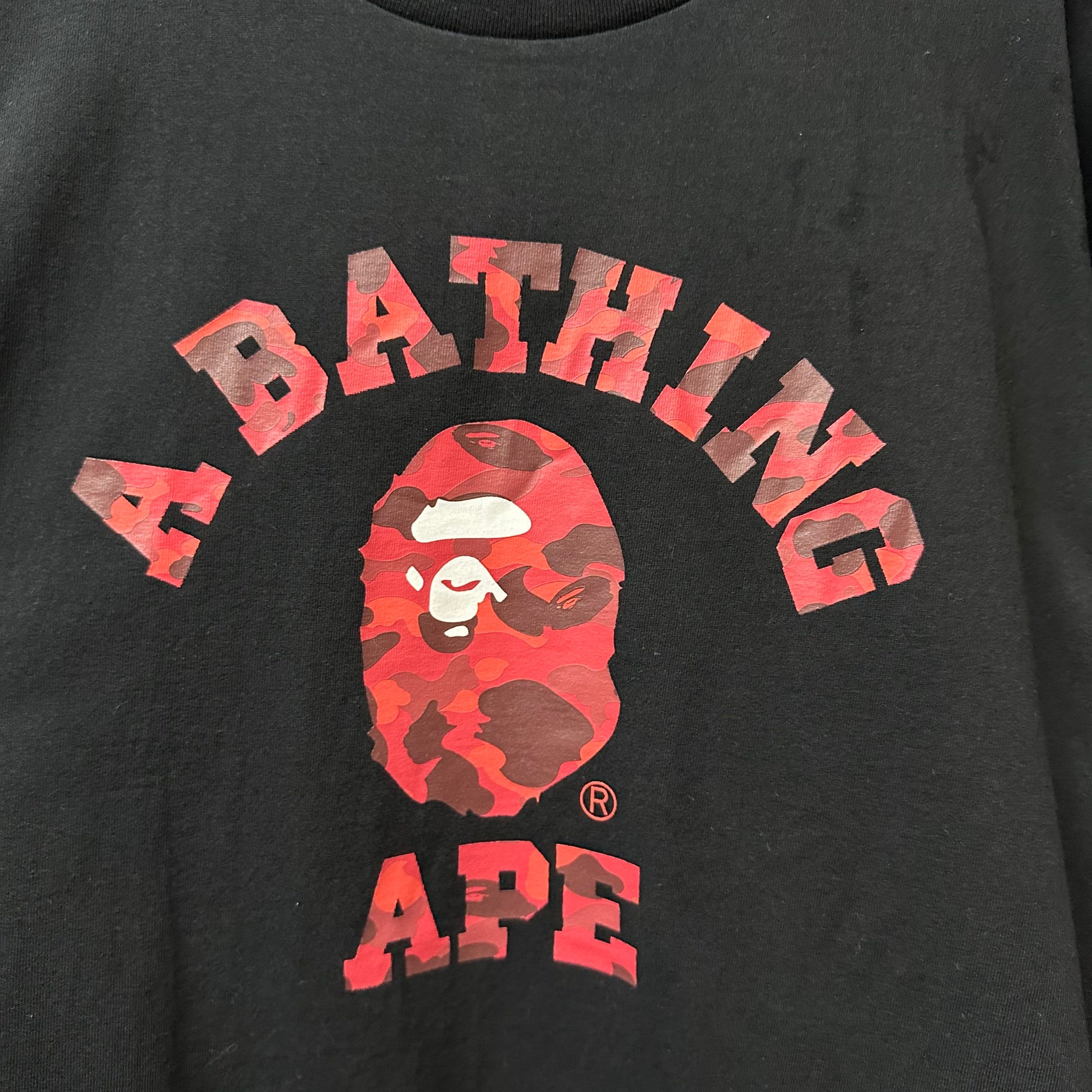 Red camouflage college graphic print detail on streetwear T-shirt