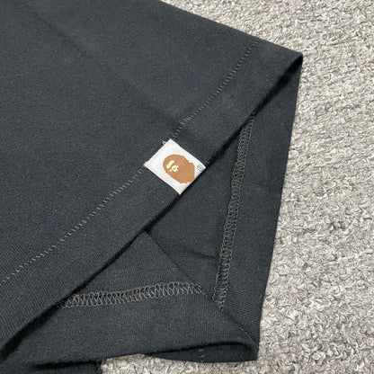 BAPE Ape Head sleeve label detail on black Space Camo T-shirt