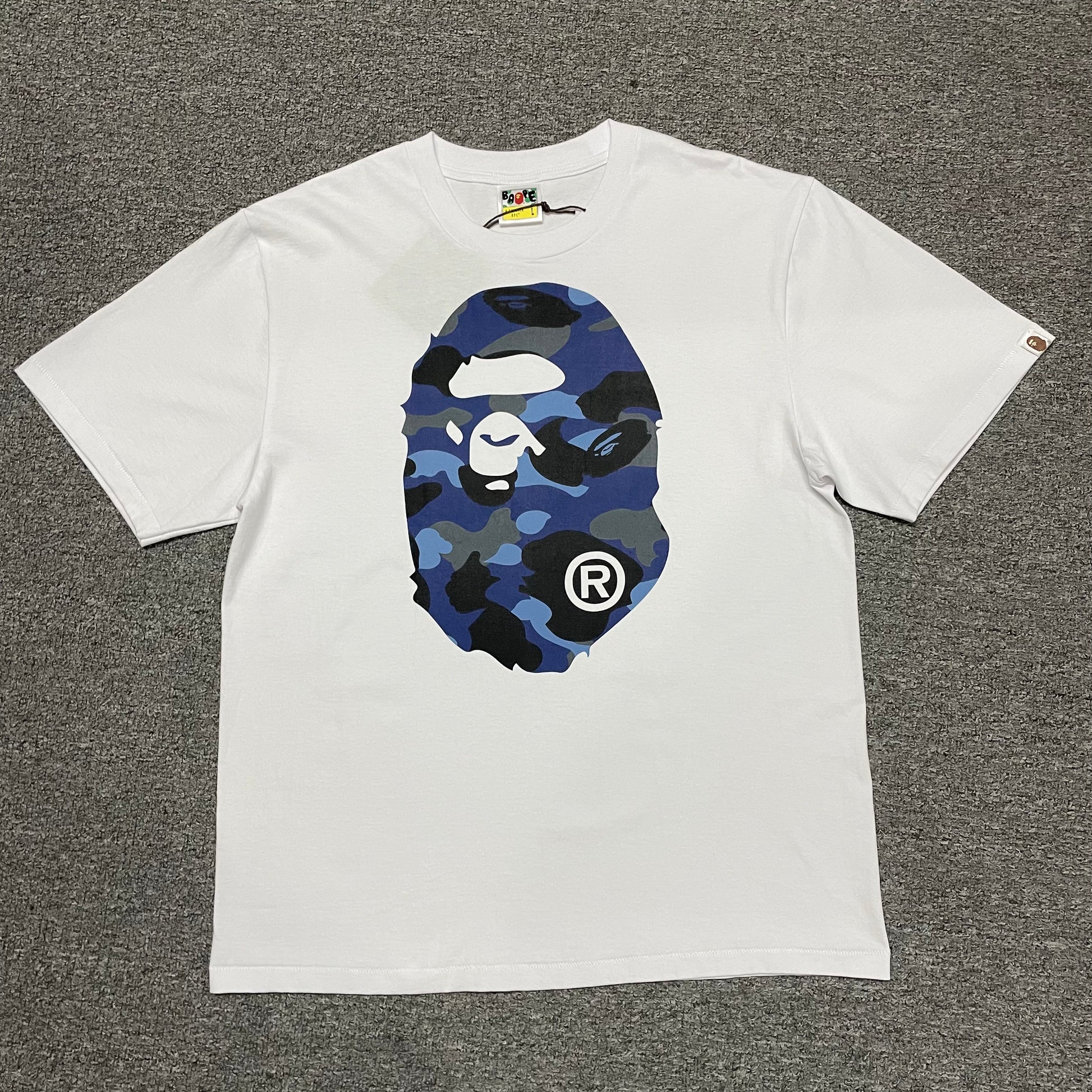 White BAPE ABC Camo Big Ape Head T-shirt front view with blue camo graphic