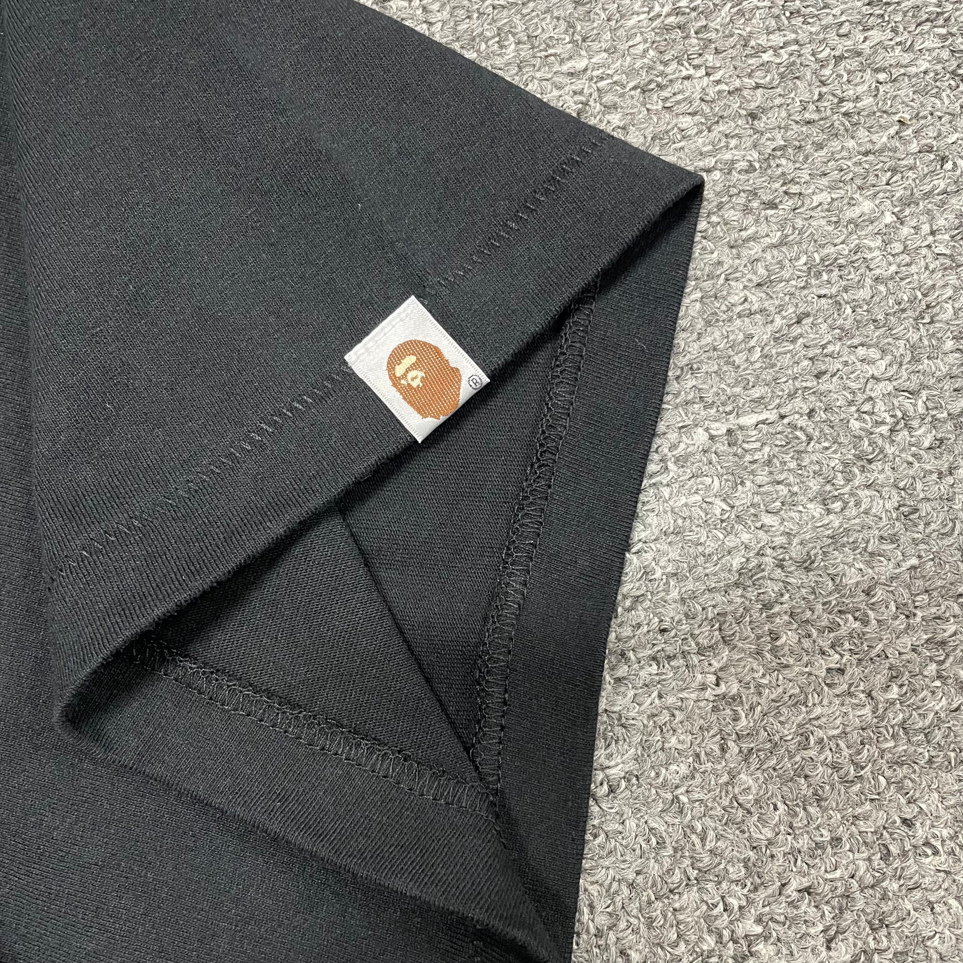 BAPE Ape Head sleeve label detail on black ABC Camo T-shirt