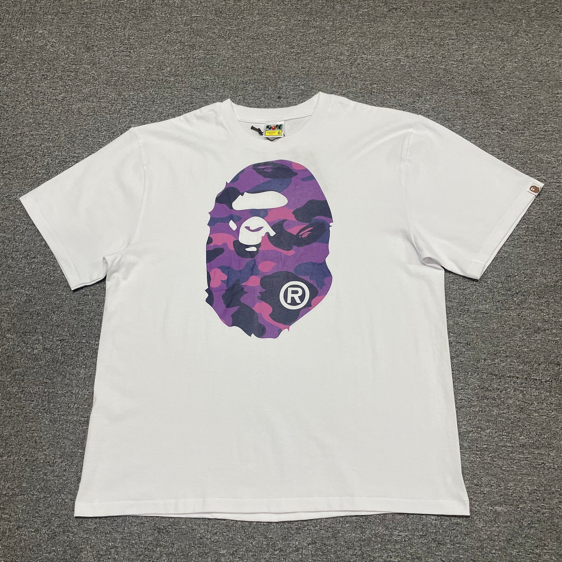White BAPE Color Camo Big Ape Head T-shirt front view with purple camo graphic