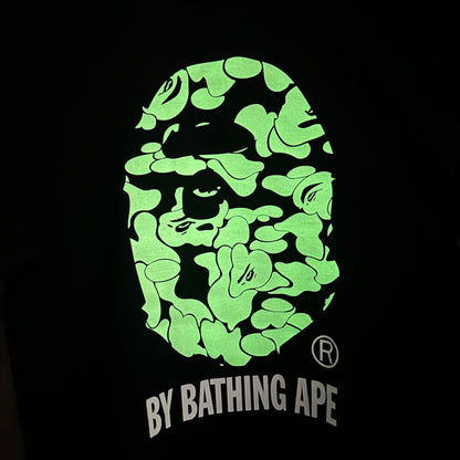 Pale green Sakura camouflage graphic on black streetwear T-shirt