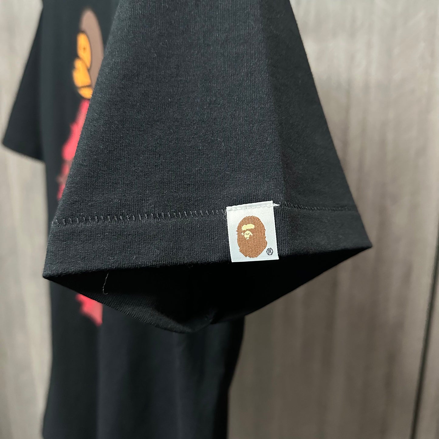 Black streetwear T-shirt sleeve label and stitching detail