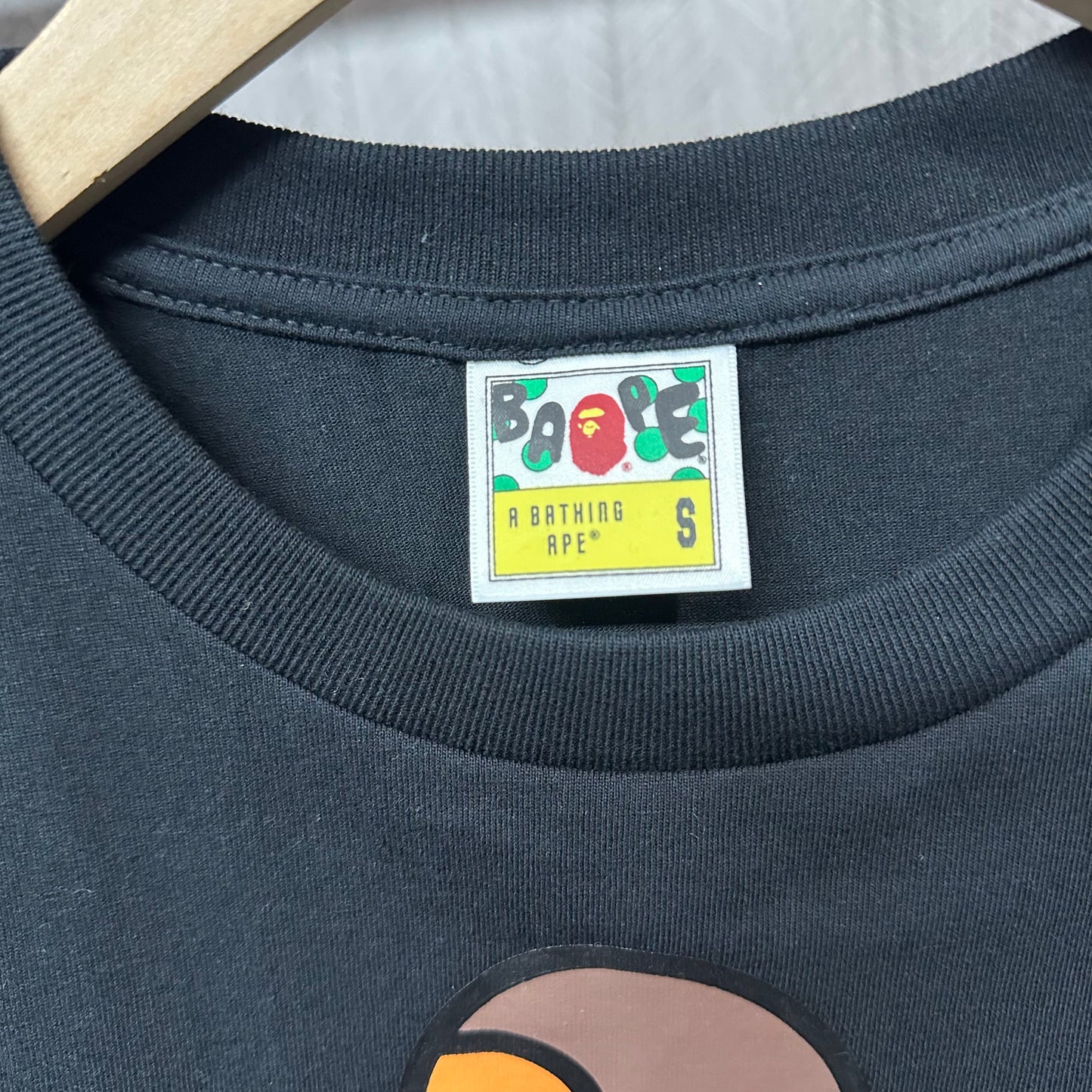 Graphic T-shirt crew neckline and woven neck label detail