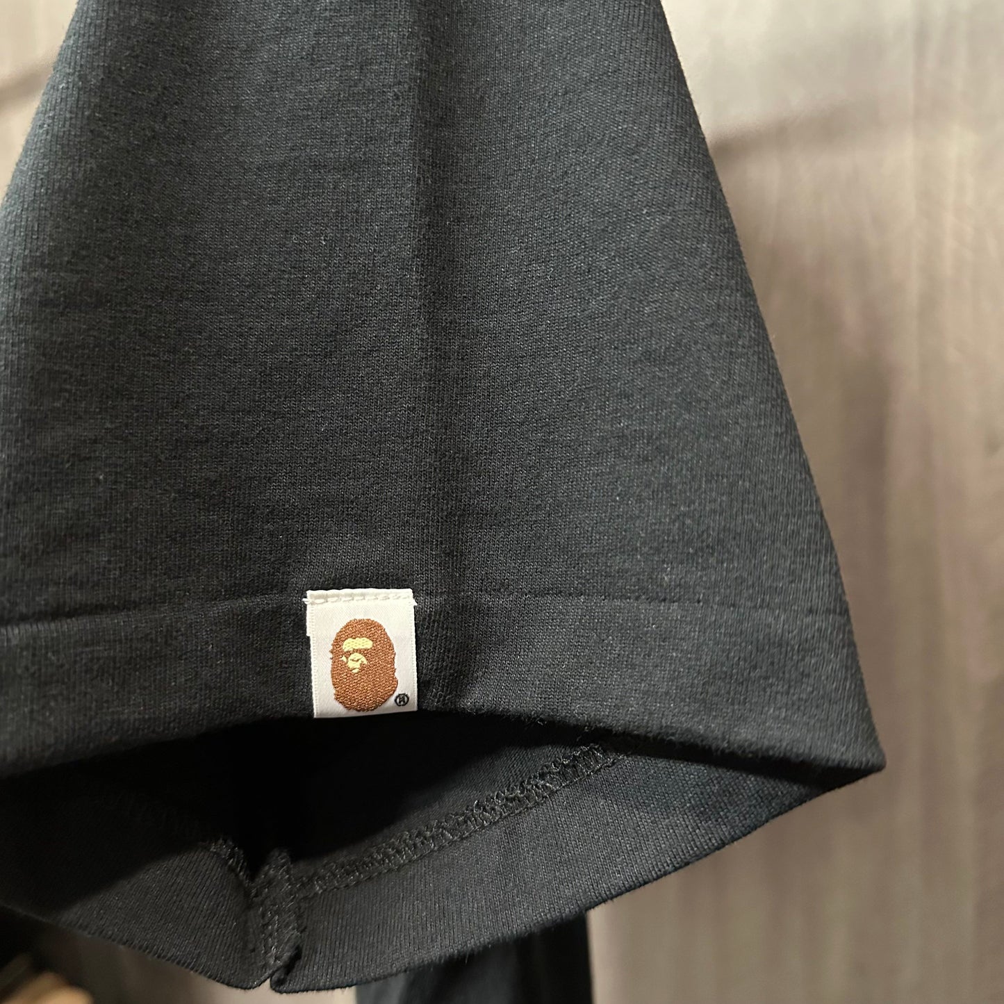 BAPE Streetwear graphic T-shirt sleeve label and stitching detail