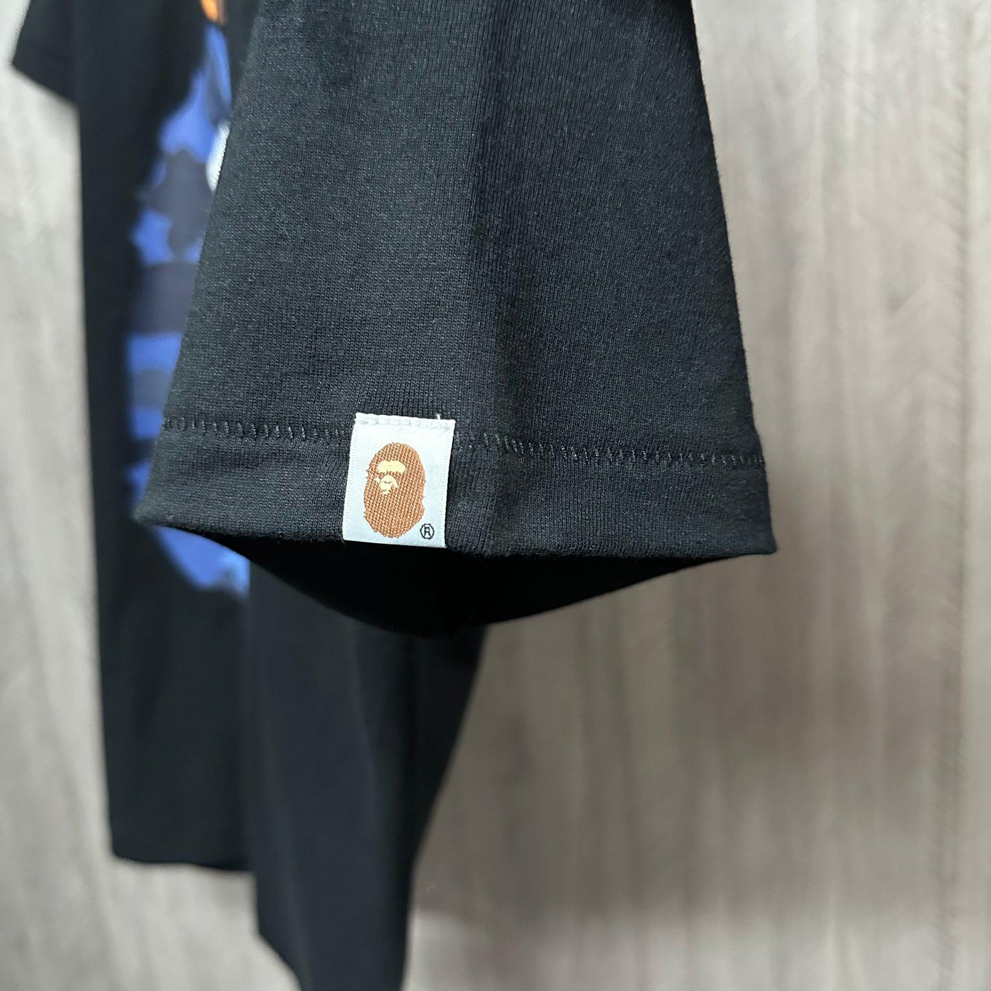 BAPE Streetwear graphic T-shirt sleeve label and stitching detail