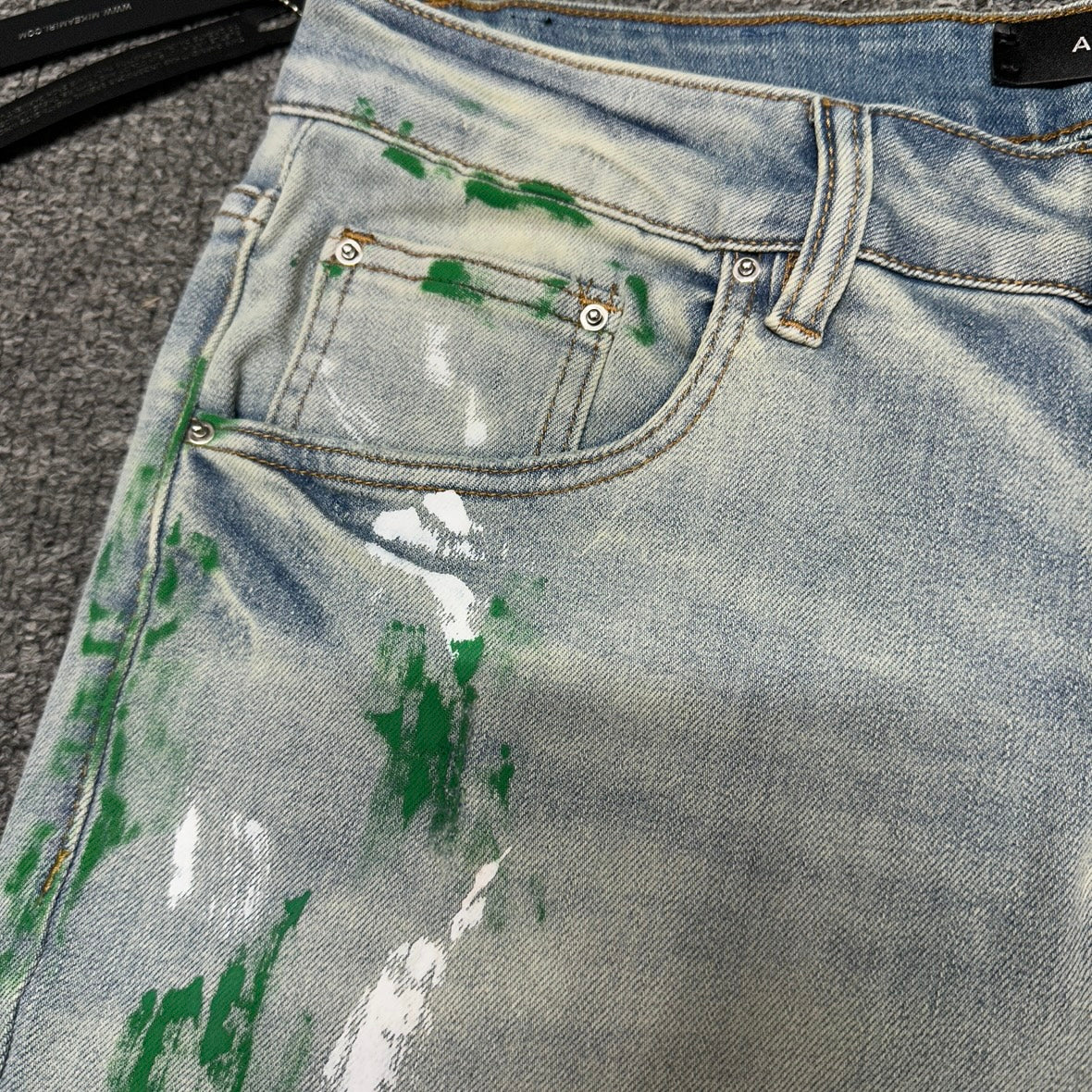 AMIRI Painter Staggered Logo Skinny Jeans Bleach Indigo