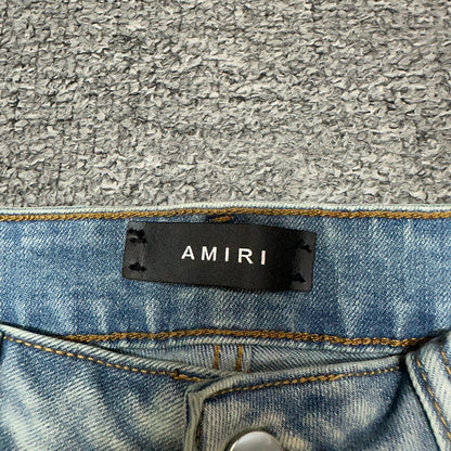 AMIRI Painter Staggered Logo Skinny Jeans Bleach Indigo