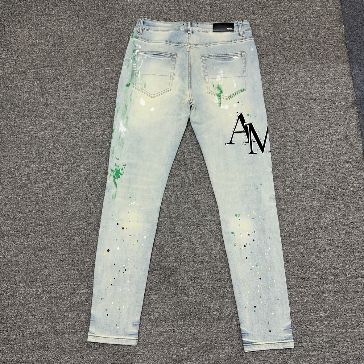 AMIRI Painter Staggered Logo Skinny Jeans Bleach Indigo