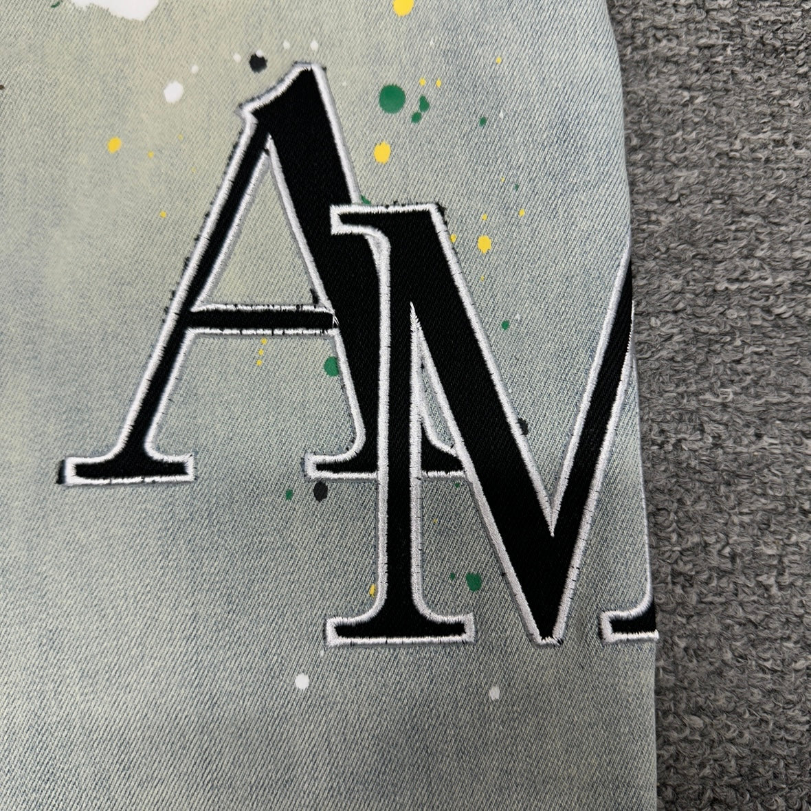AMIRI Painter Staggered Logo Skinny Jeans Bleach Indigo