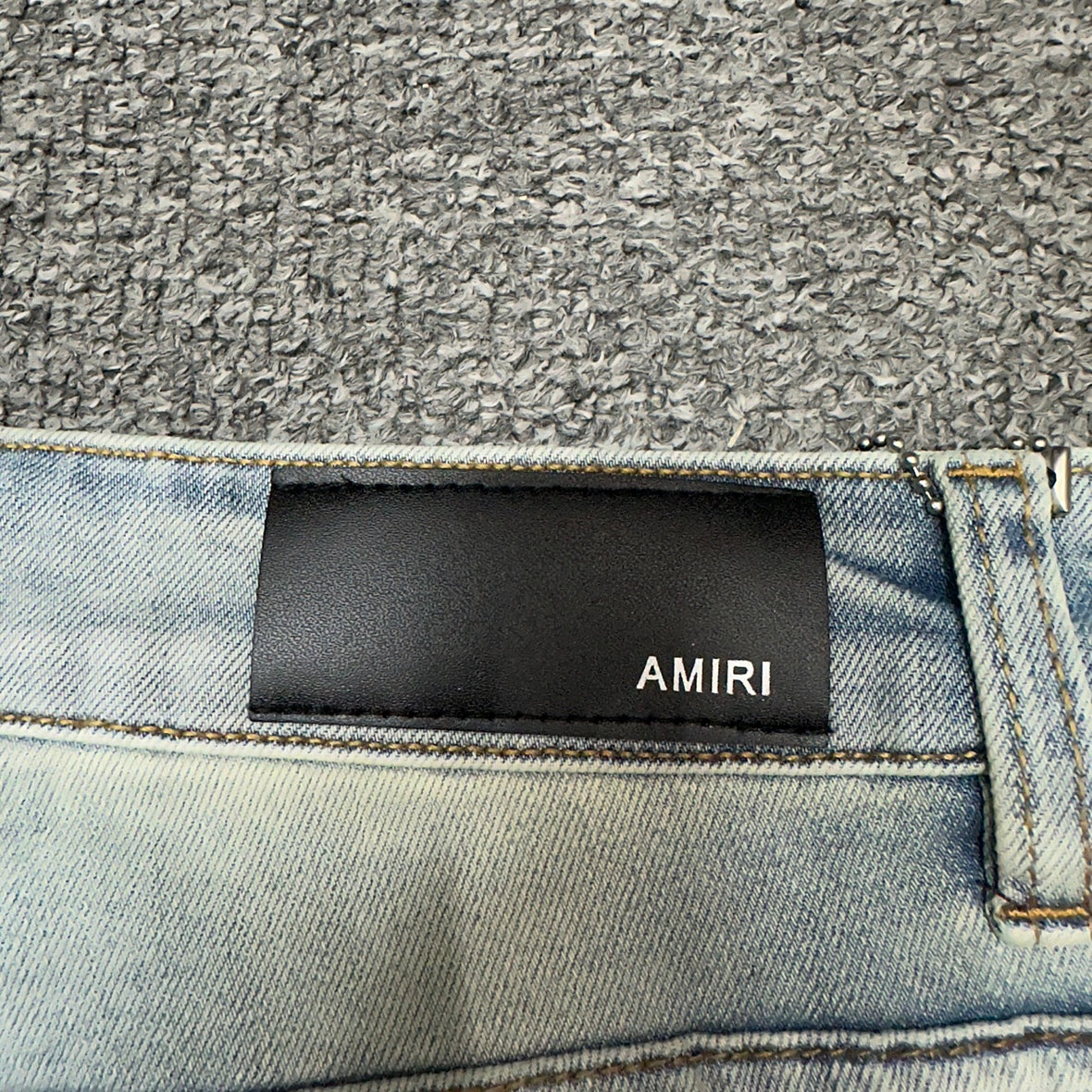 AMIRI Painter Staggered Logo Skinny Jeans Bleach Indigo