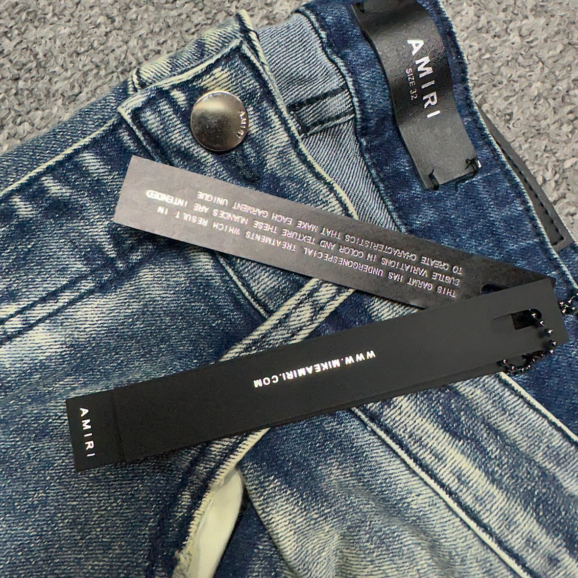 AMIRI Painter Staggered Logo Skinny Jeans Bleach Indigo