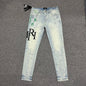 AMIRI Painter Staggered Logo Skinny Jeans Bleach Indigo