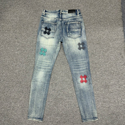 AMIRI Multicolor MA Quad Appliqué Distressed Jeans