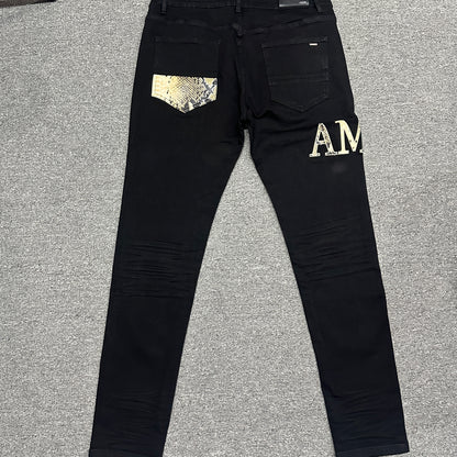 AMIRI Staggered Logo Skinny Jeans Black Gold