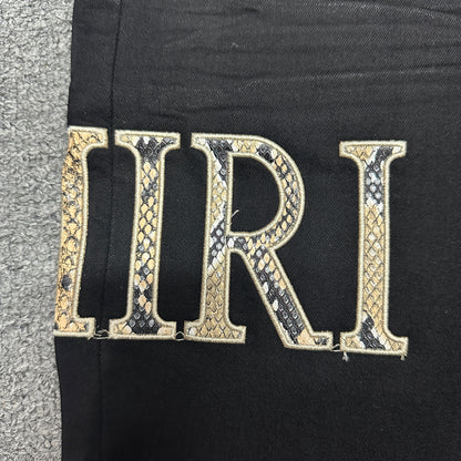 AMIRI Staggered Logo Skinny Jeans Black Gold