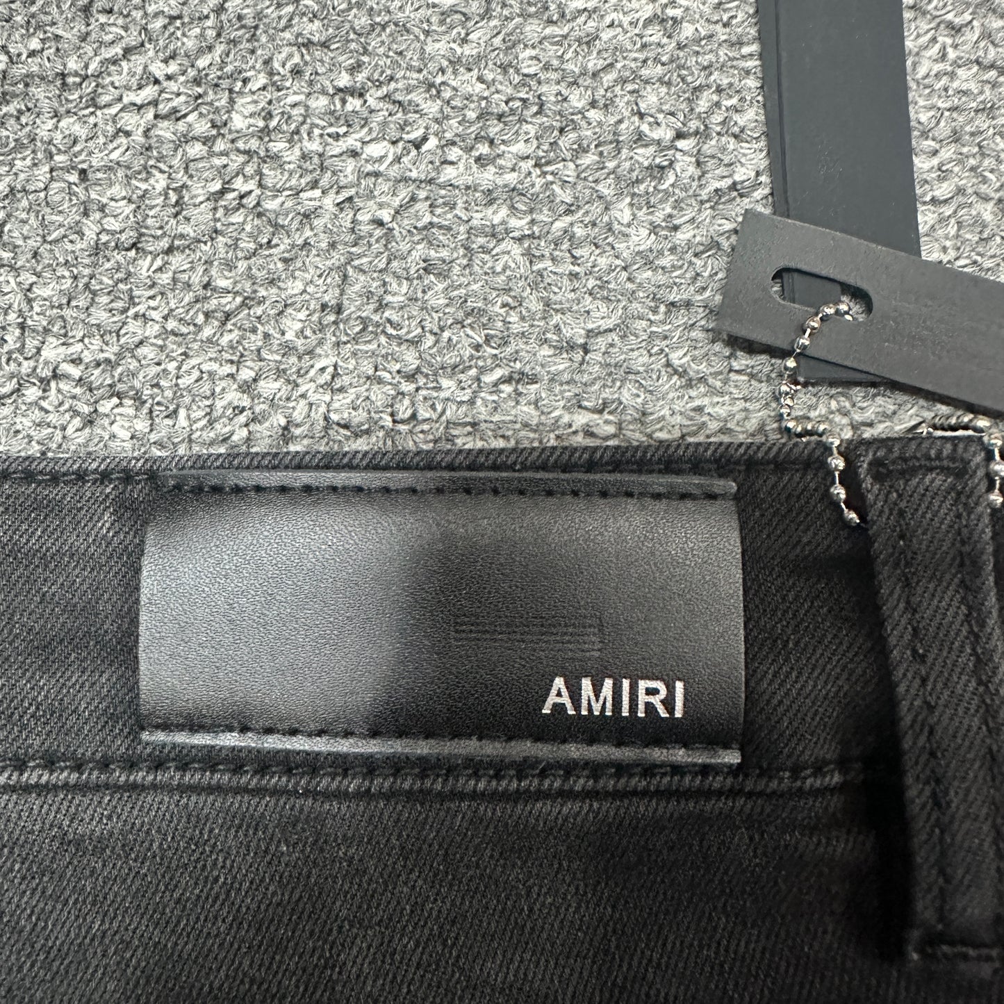 AMIRI Painter Staggered Logo Skinny Jeans Washed Black