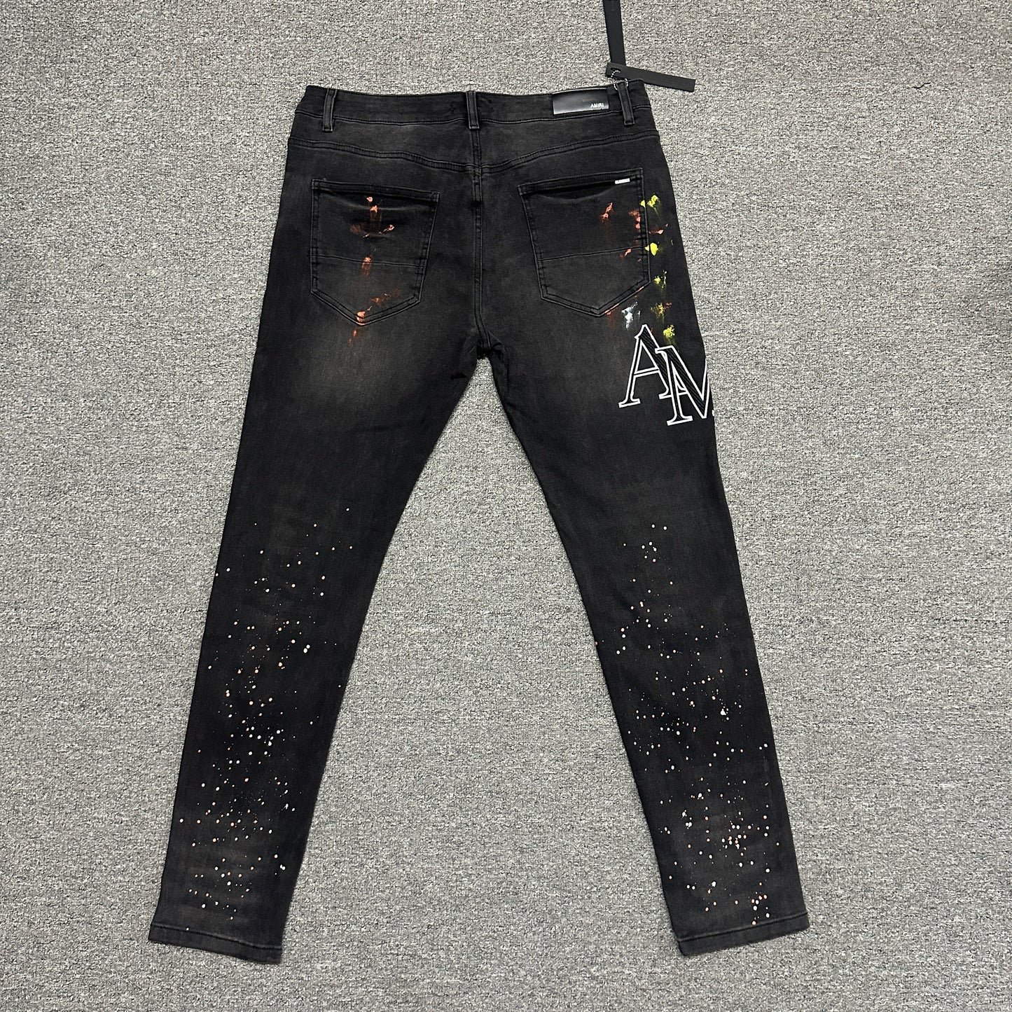 AMIRI Painter Staggered Logo Skinny Jeans Washed Black