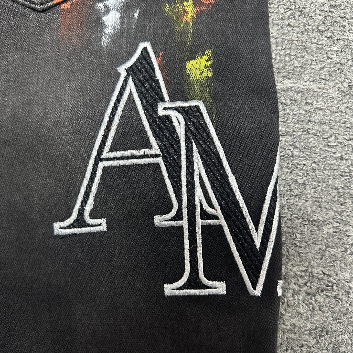 AMIRI Painter Staggered Logo Skinny Jeans Washed Black