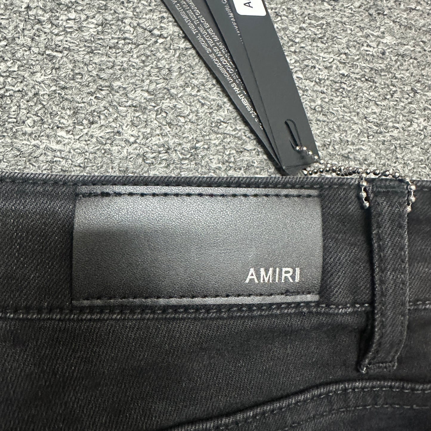AMIRI Western Patch Distressed Jeans Faded Black