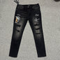 AMIRI Western Patch Distressed Jeans Faded Black