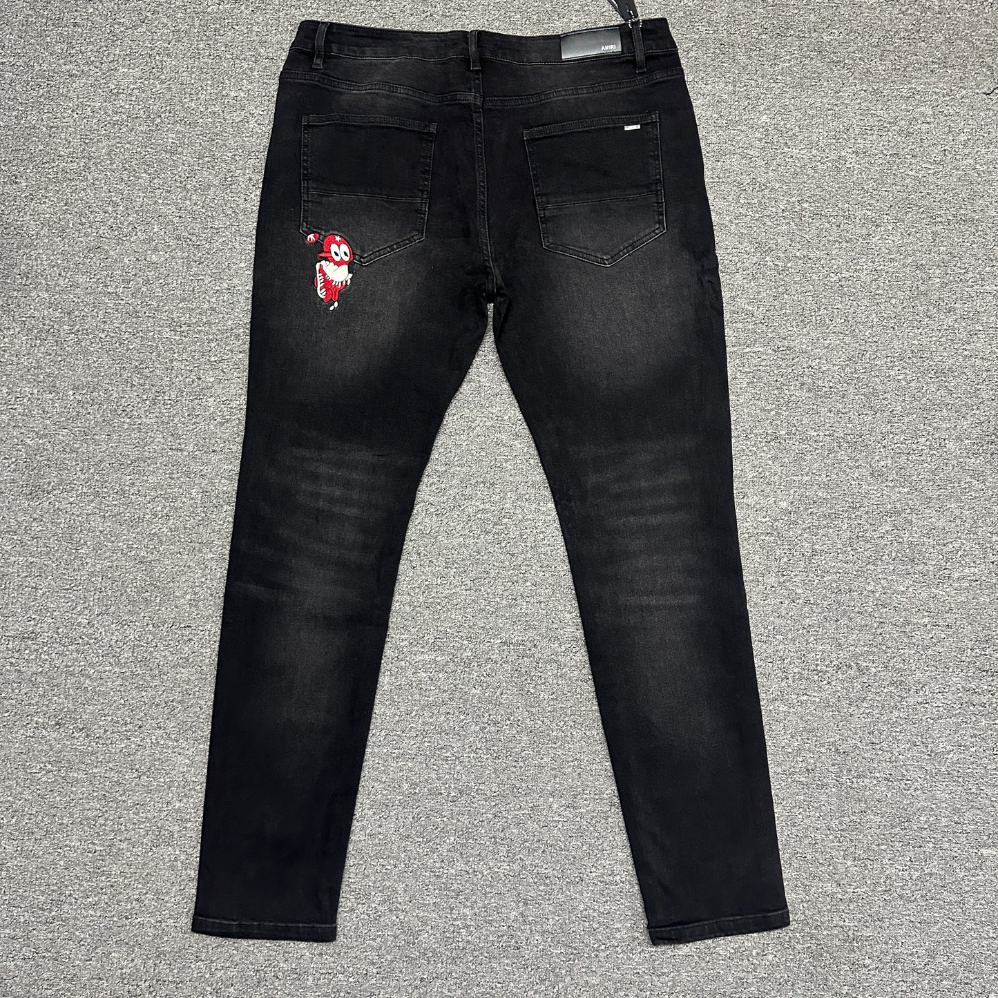 AMIRI Western Patch Distressed Jeans Faded Black