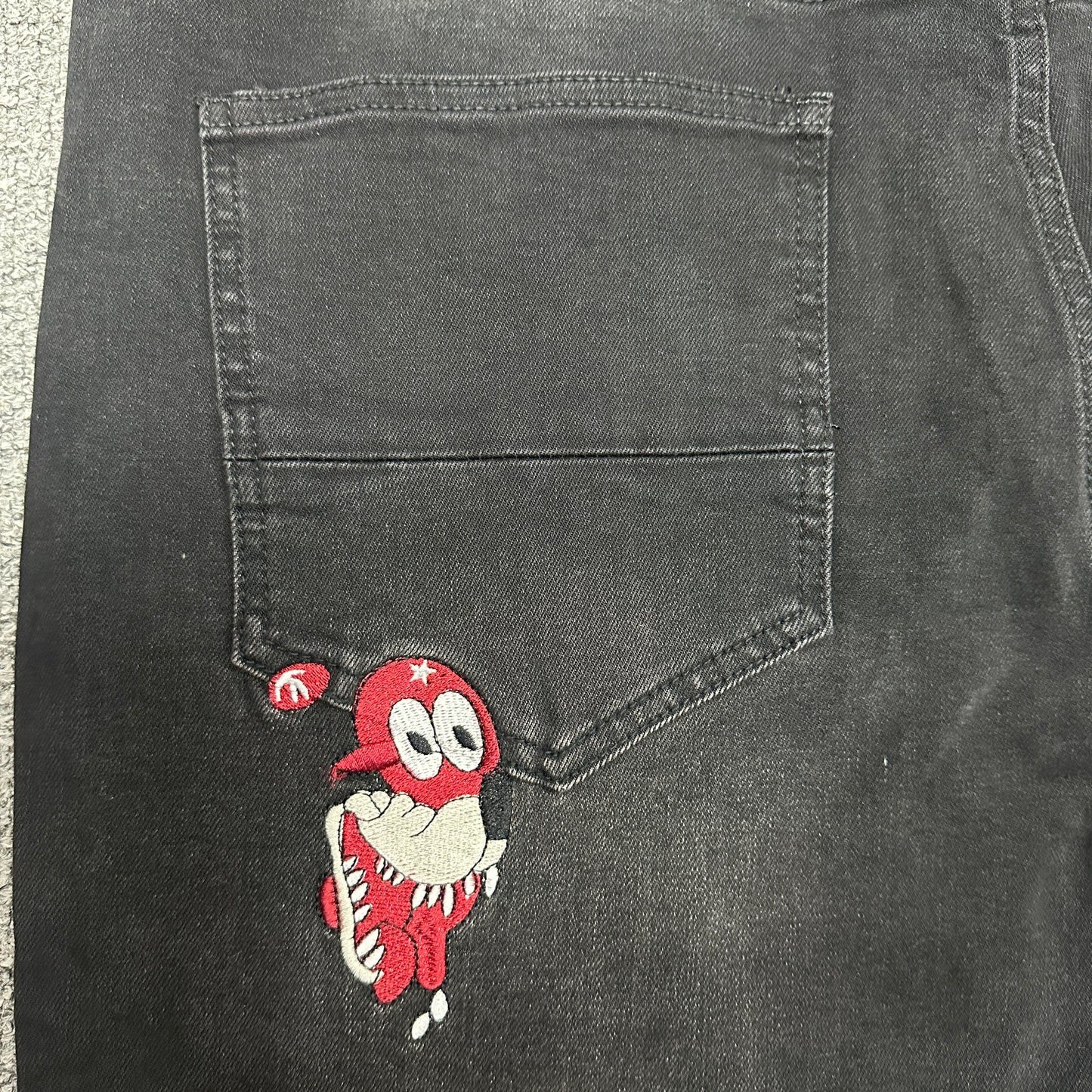 AMIRI Western Patch Distressed Jeans Faded Black