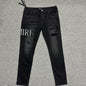 AMIRI Staggered Logo Distressed Skinny Jeans Washed Black